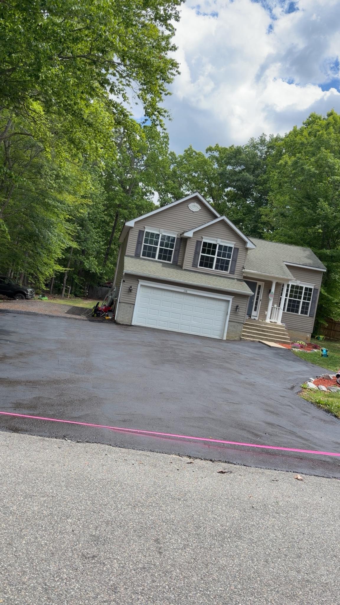 Sealed driveway at a wooded property